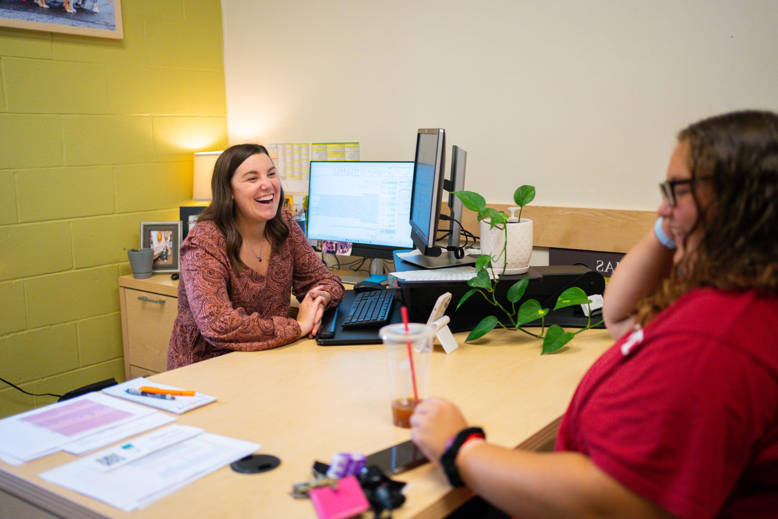 Professional and Career Development advisor meets with a student in her office